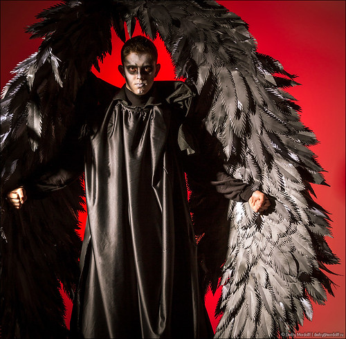 carnival boy red people holiday black male men guy halloween colors vertical angel night dark studio person death costume image serious painted watching hell wing makeup evil spooky human horror demon teenager devil emotions caucasian
