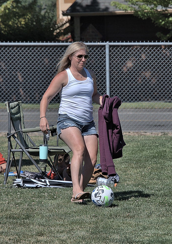 woman female lady mother shorts kick ball blonde soccer